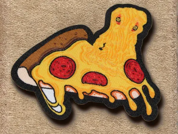 Custom woven patch featuring a melting pizza monster character with cheese and pepperoni