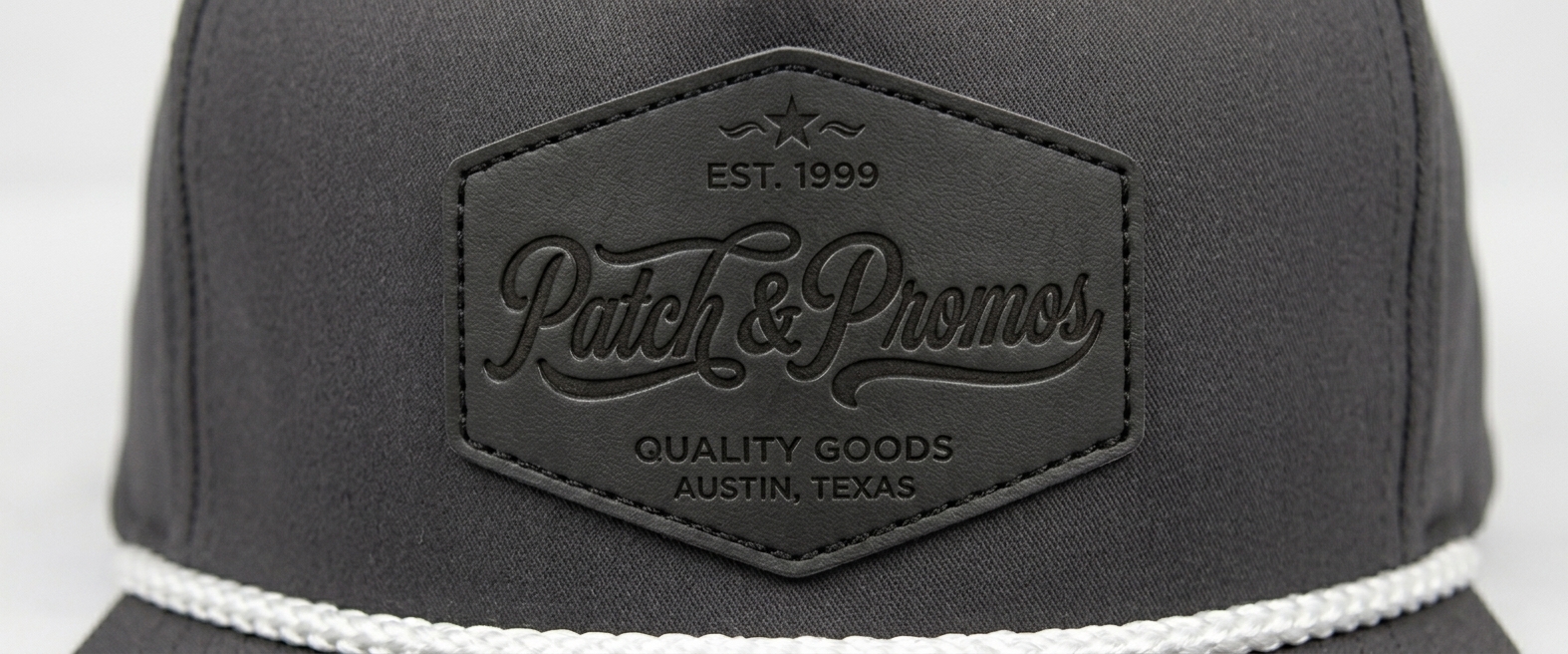 Custom dad hat in brown with embossed leather Patch & Promos hexagon patch