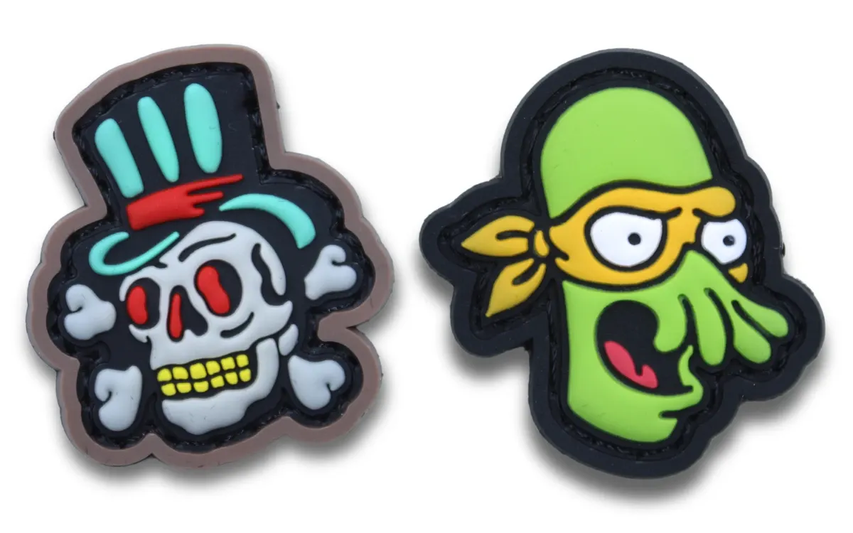 Two very unique custom PVC patches with characters on them